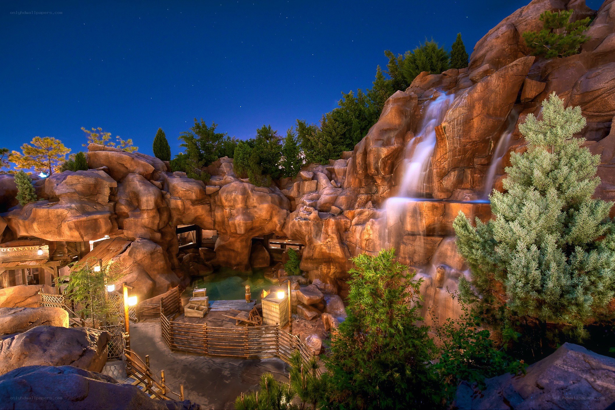 Nighttime waterfall at a theme park