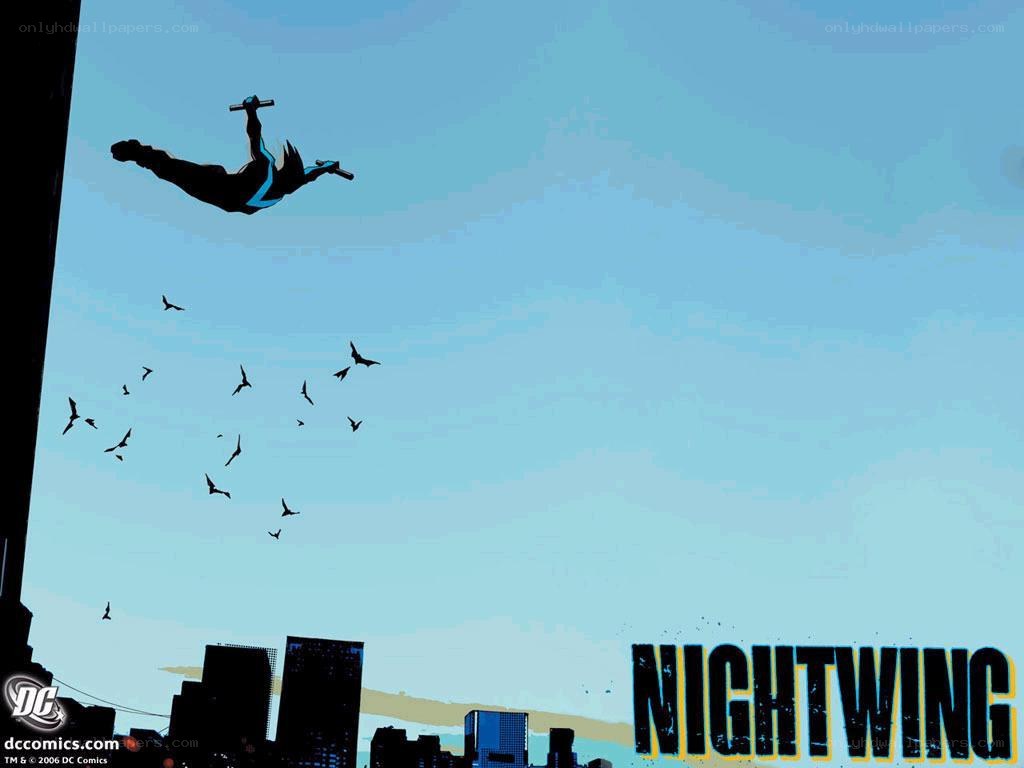 Nightwing in flight over city