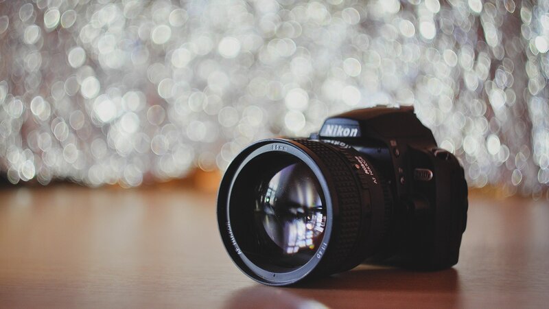 Nikon Camera on Table — Black