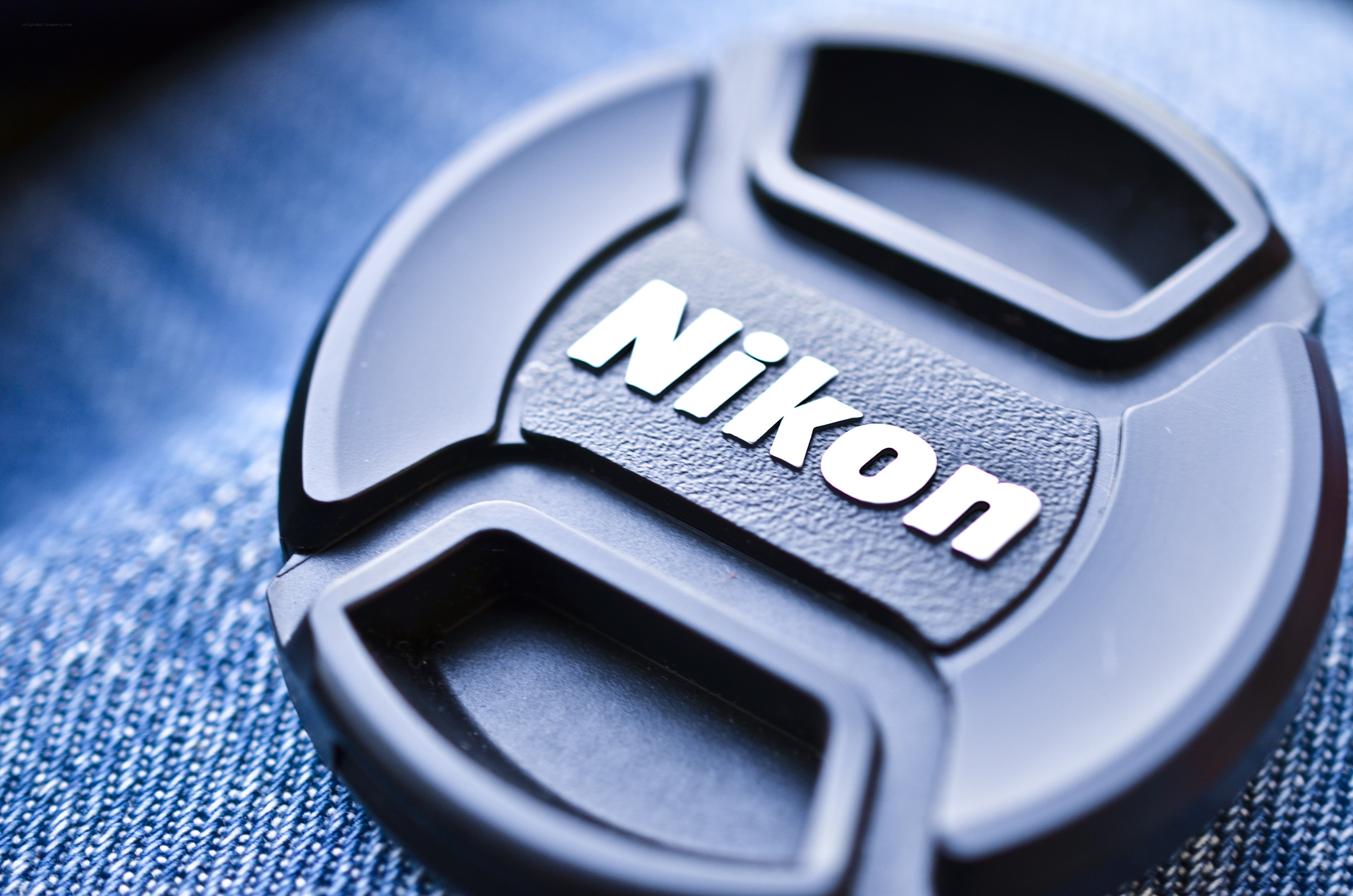 Nikon lens cap on denim