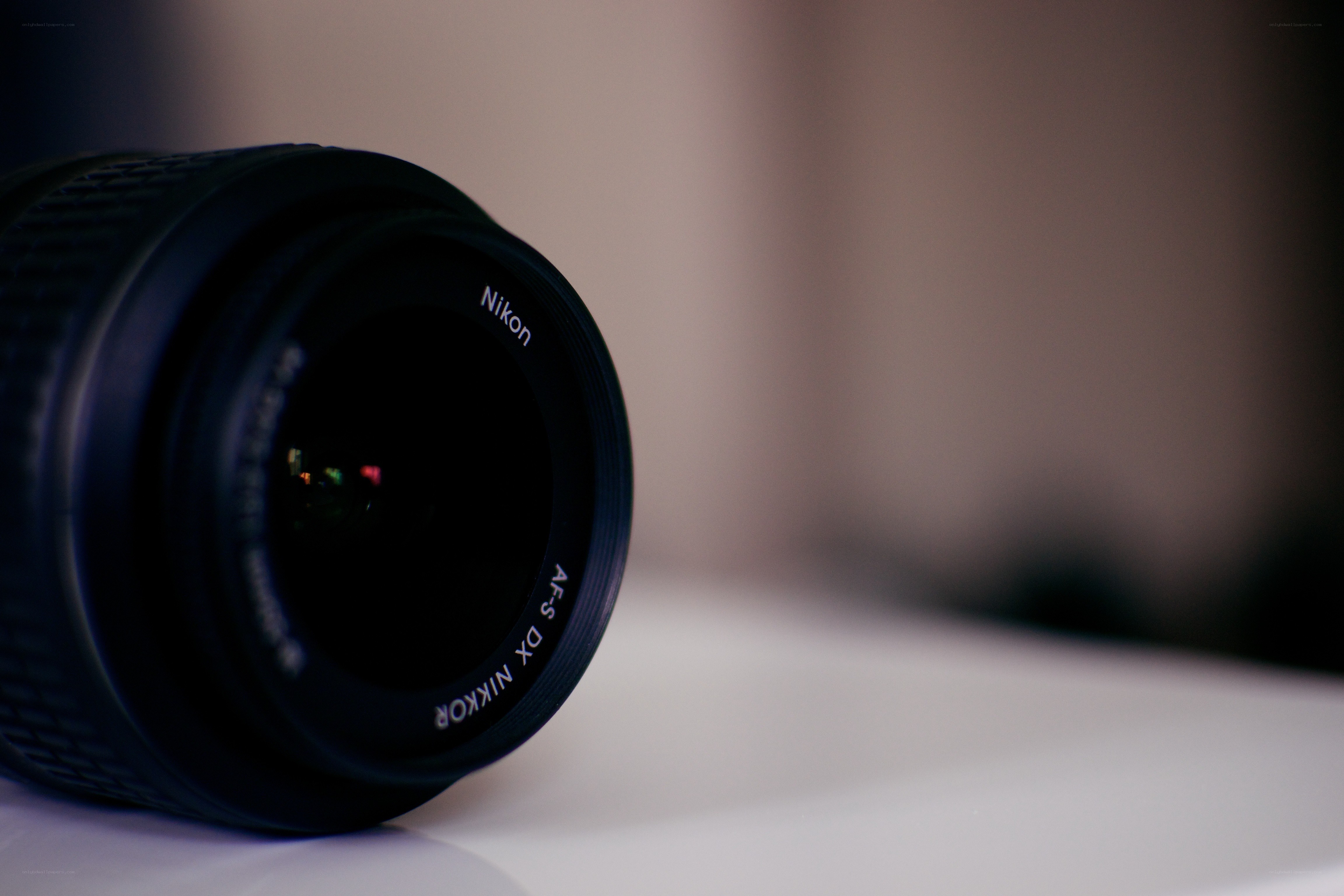 Nikon lens on a white surface