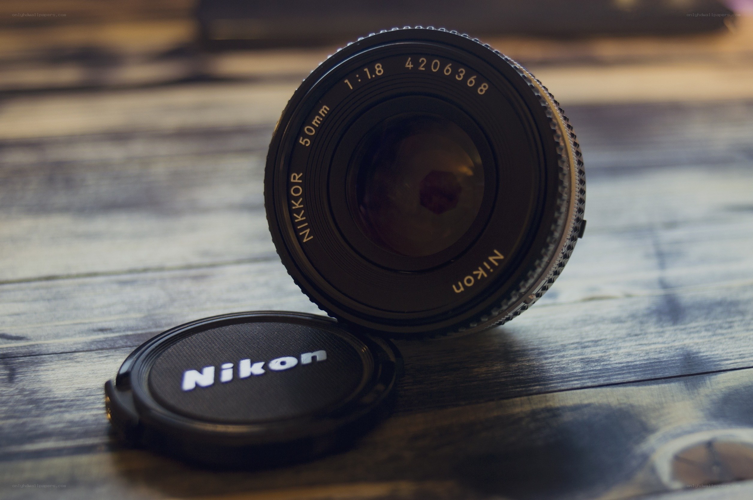 Nikon lens on wooden surface