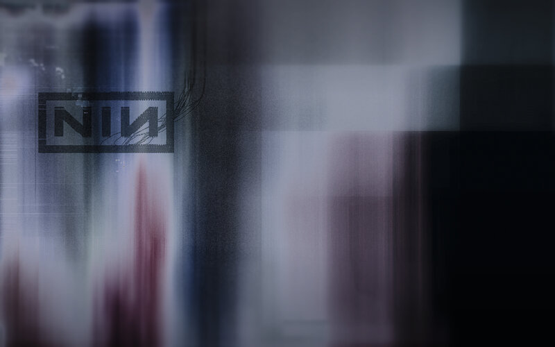 NIN Logo on Abstract Background — Gray