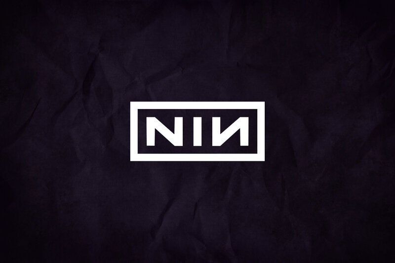 NIN logo on dark background