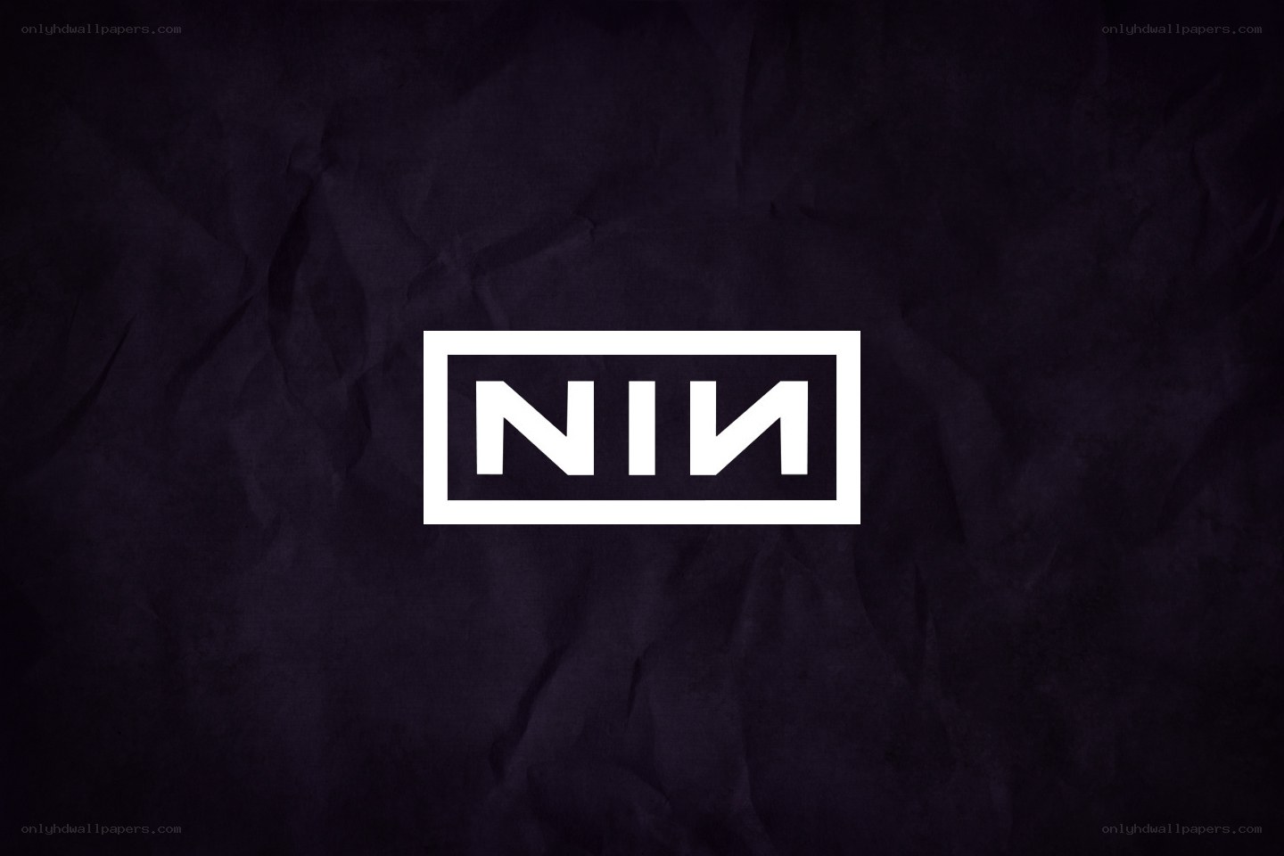 NIN logo on dark background