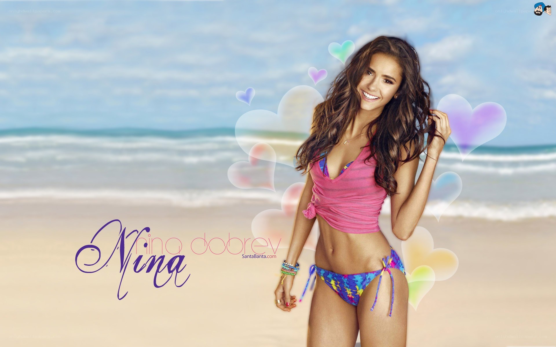 Nina Dobrev at the beach