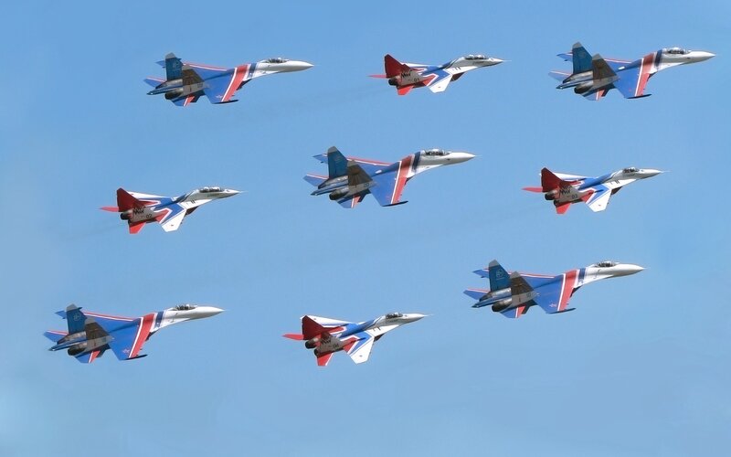 Nine Fighter Jets in Formation — Blue