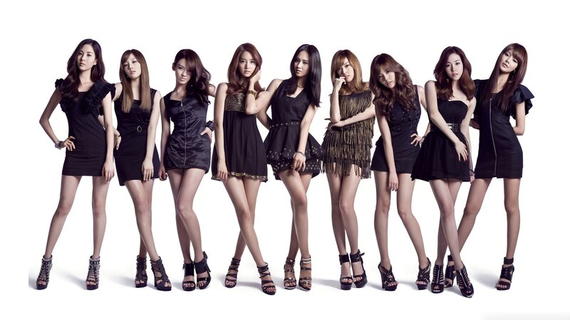 nine women in black dresses