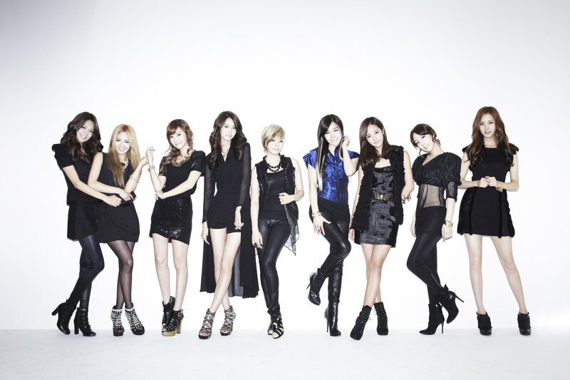 Nine Women in Black Outfits — Confident, Photograph, Dresses