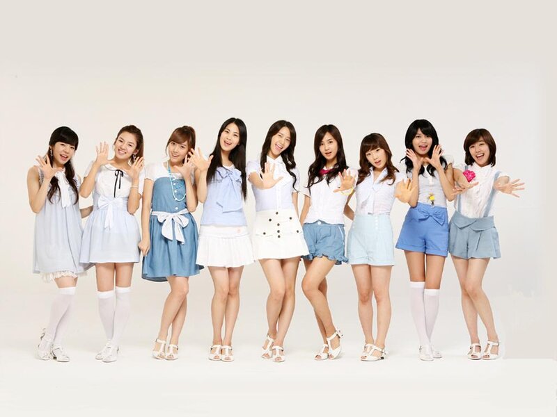 Nine Women in Coordinated Outfits — White