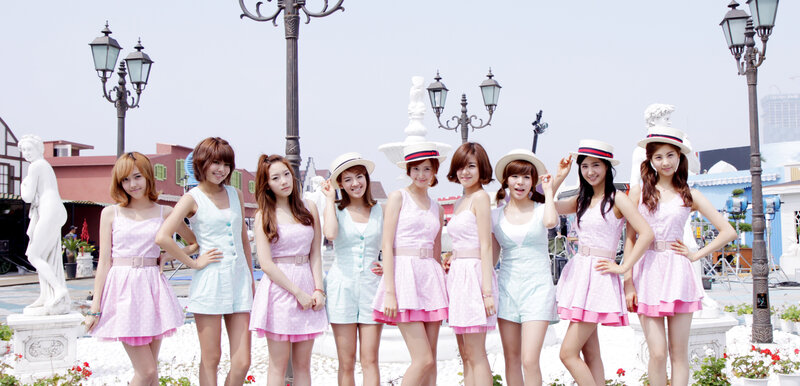Nine Women in Matching Dresses