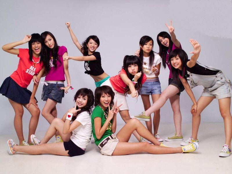 Nine Young Women Posing — White