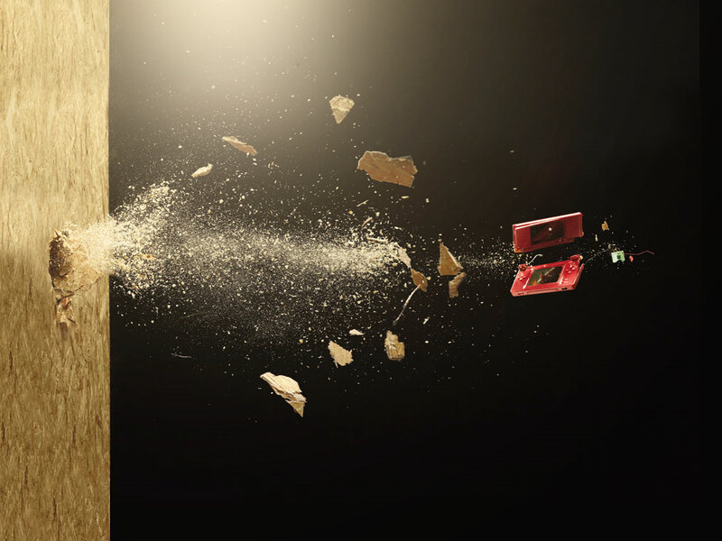 Nintendo DS breaking through wood