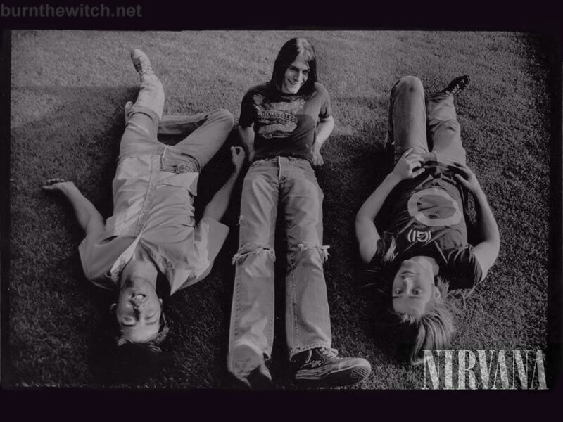 Nirvana band members on grass