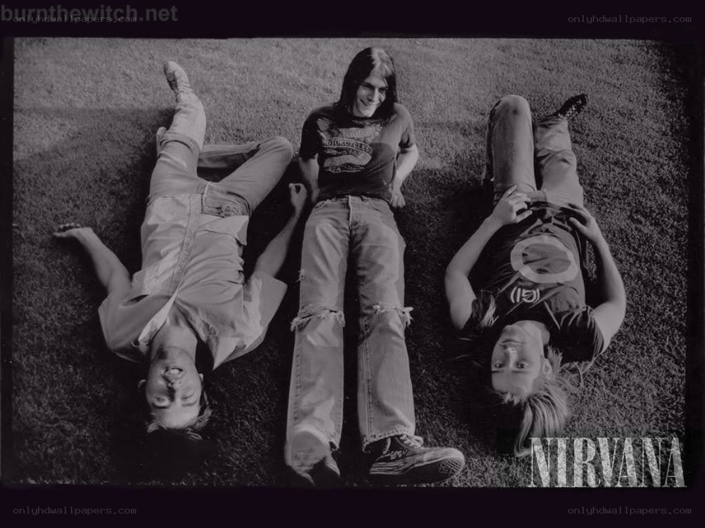 Nirvana band members on grass