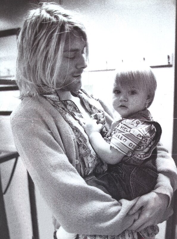 Nirvana frontman holding child