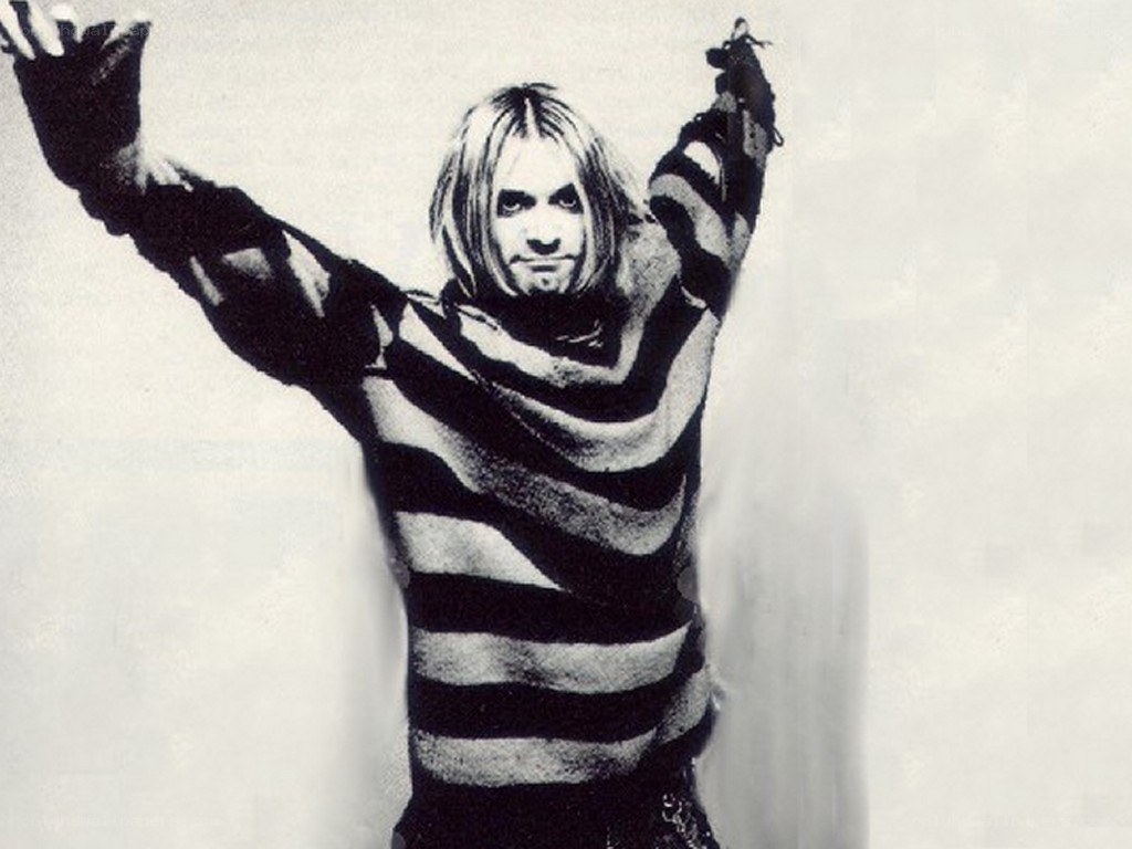 Nirvana frontman with arms raised