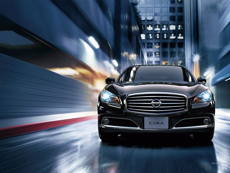 Nissan Cima in city at night