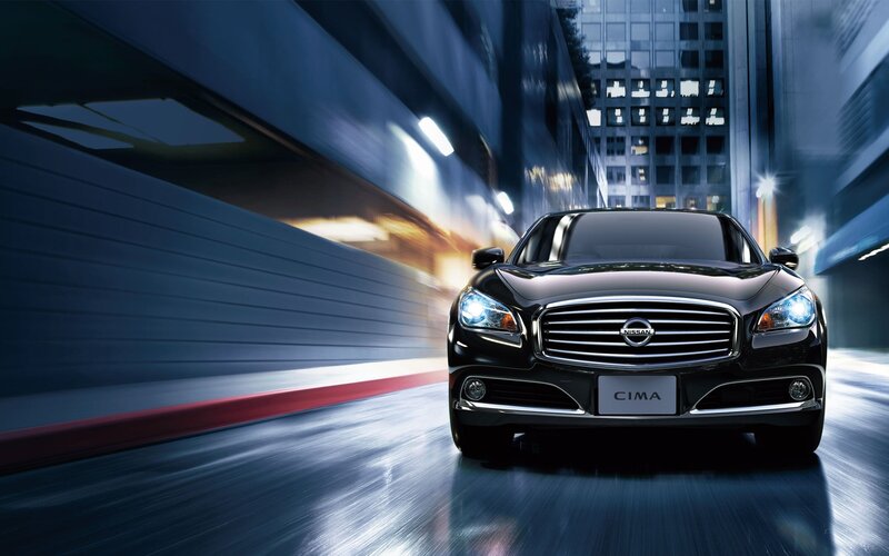 Nissan Cima in city at night
