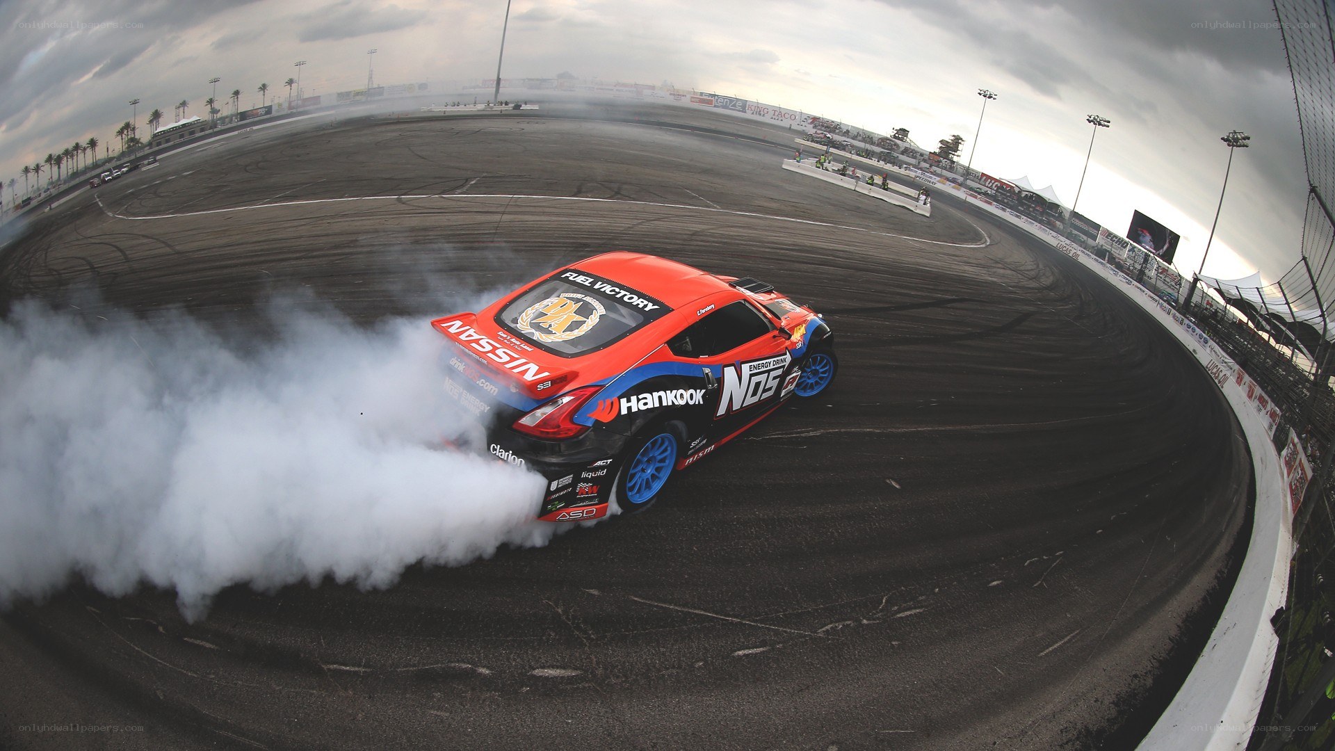 Nissan drifting on racetrack
