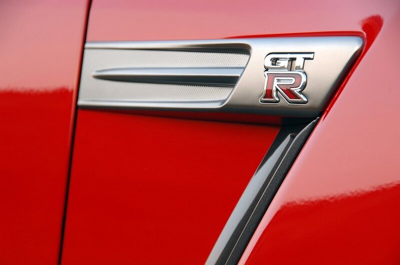Nissan GT-R badge on red car