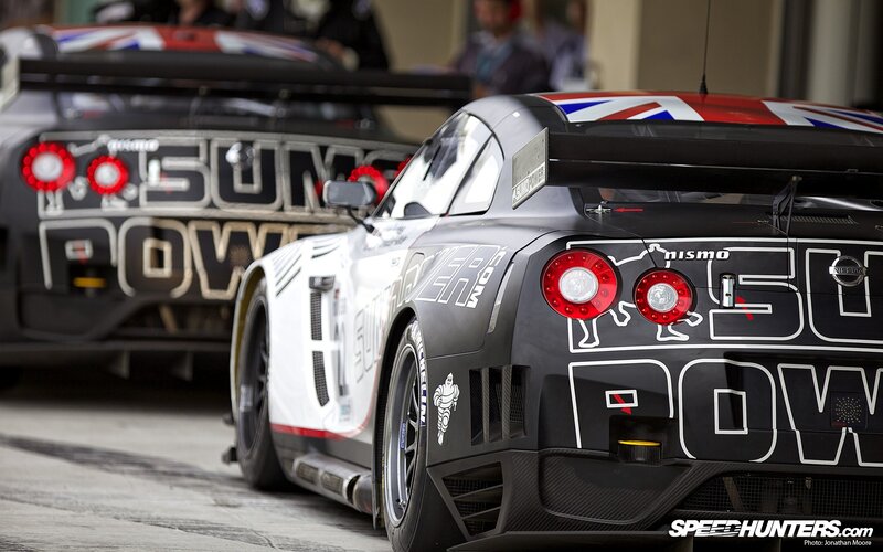 Nissan GT-R race cars in pit lane