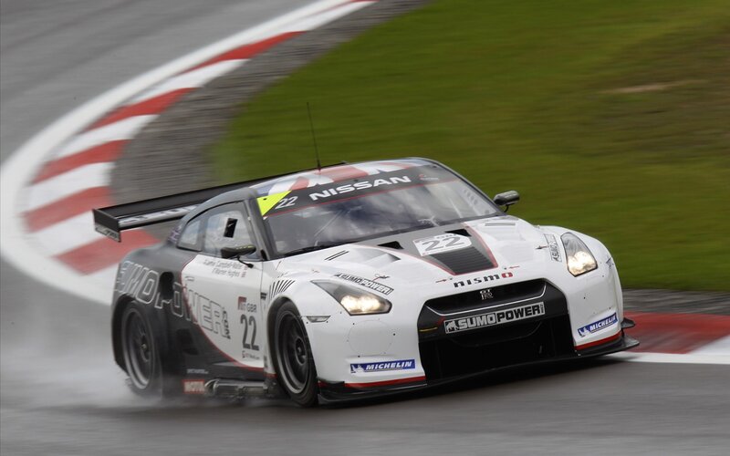 Nissan GT-R racing on wet track