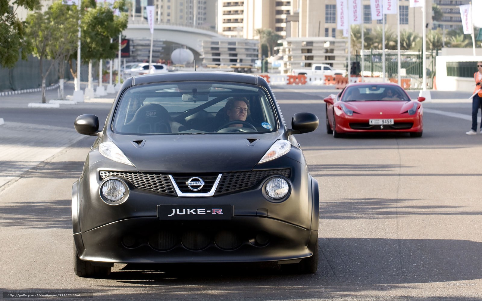 Nissan Juke-R and Ferrari on track