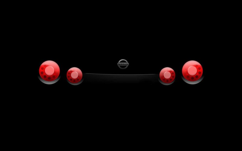 Nissan logo with red lights