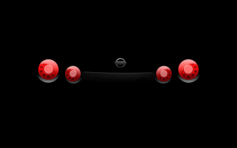 Nissan logo with red lights
