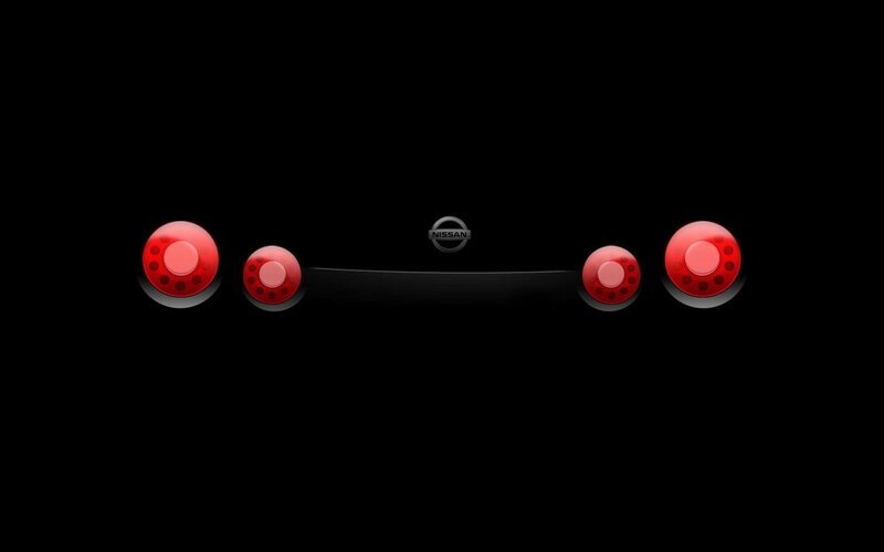 Nissan logo with red lights