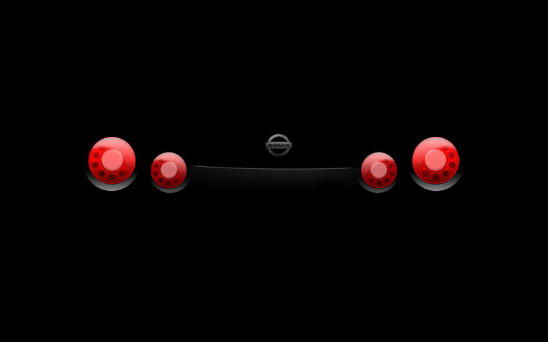 Nissan logo with red lights