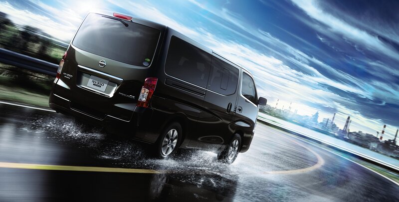 Nissan NV350 driving on wet road