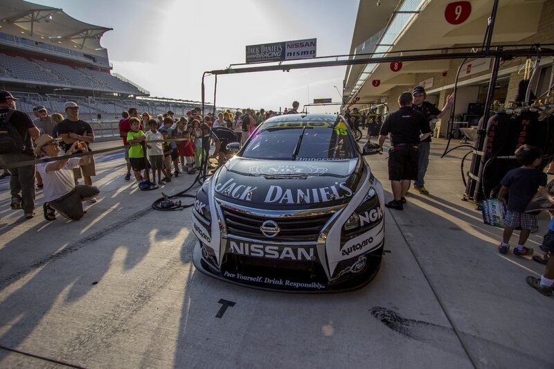 Nissan race car in pit lane