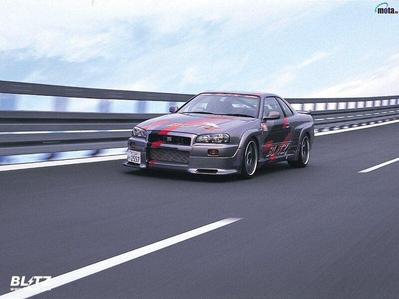 Nissan Skyline racing on a highway