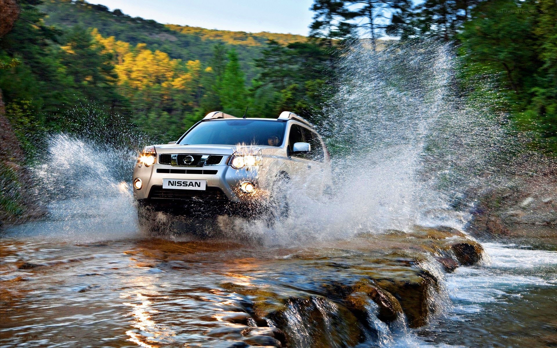 Nissan SUV crossing a river