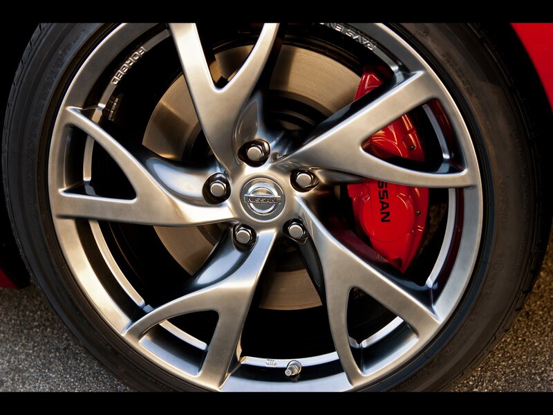 Nissan wheel with red brake caliper