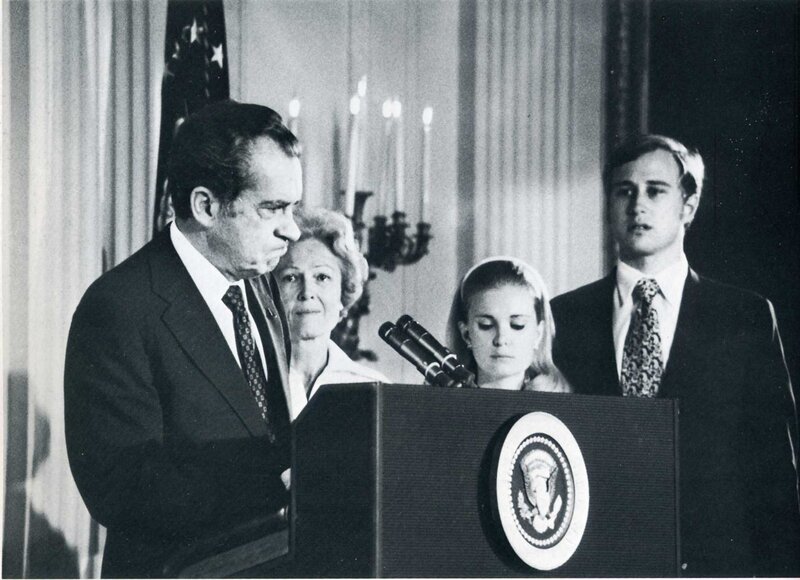 Nixon at podium with family