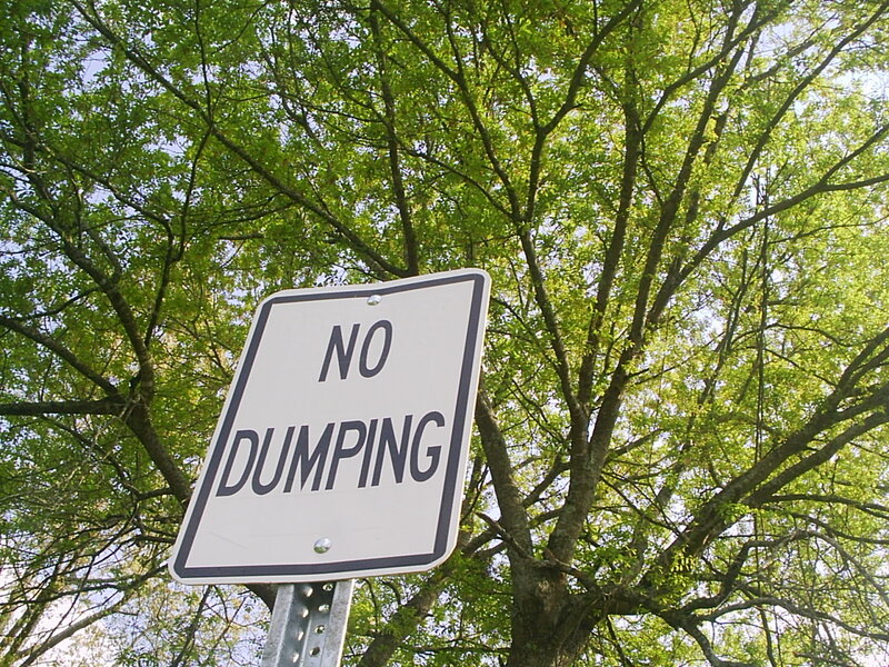No Dumping sign in trees