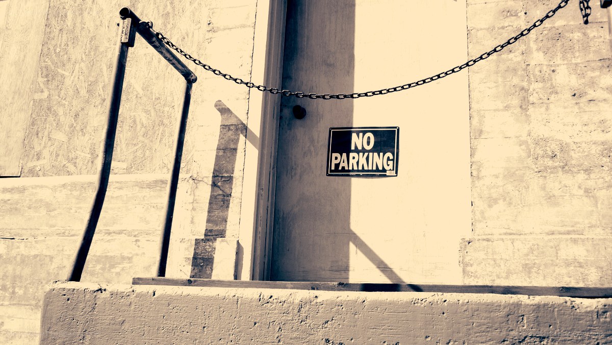 No Parking sign on door