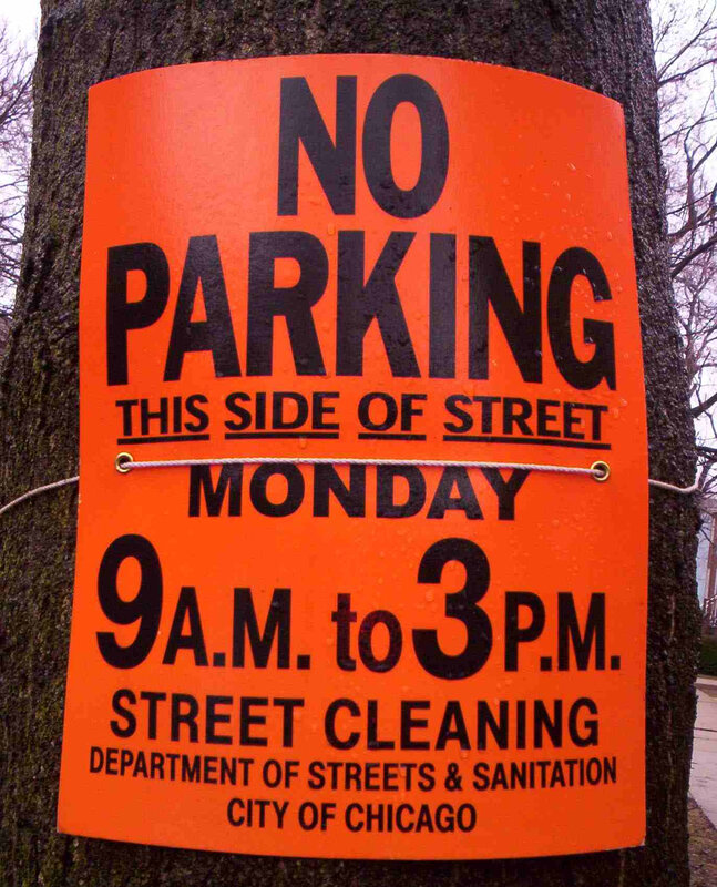 No parking sign on tree