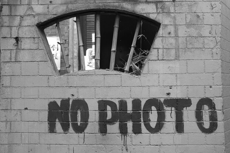 No Photo graffiti on brick wall