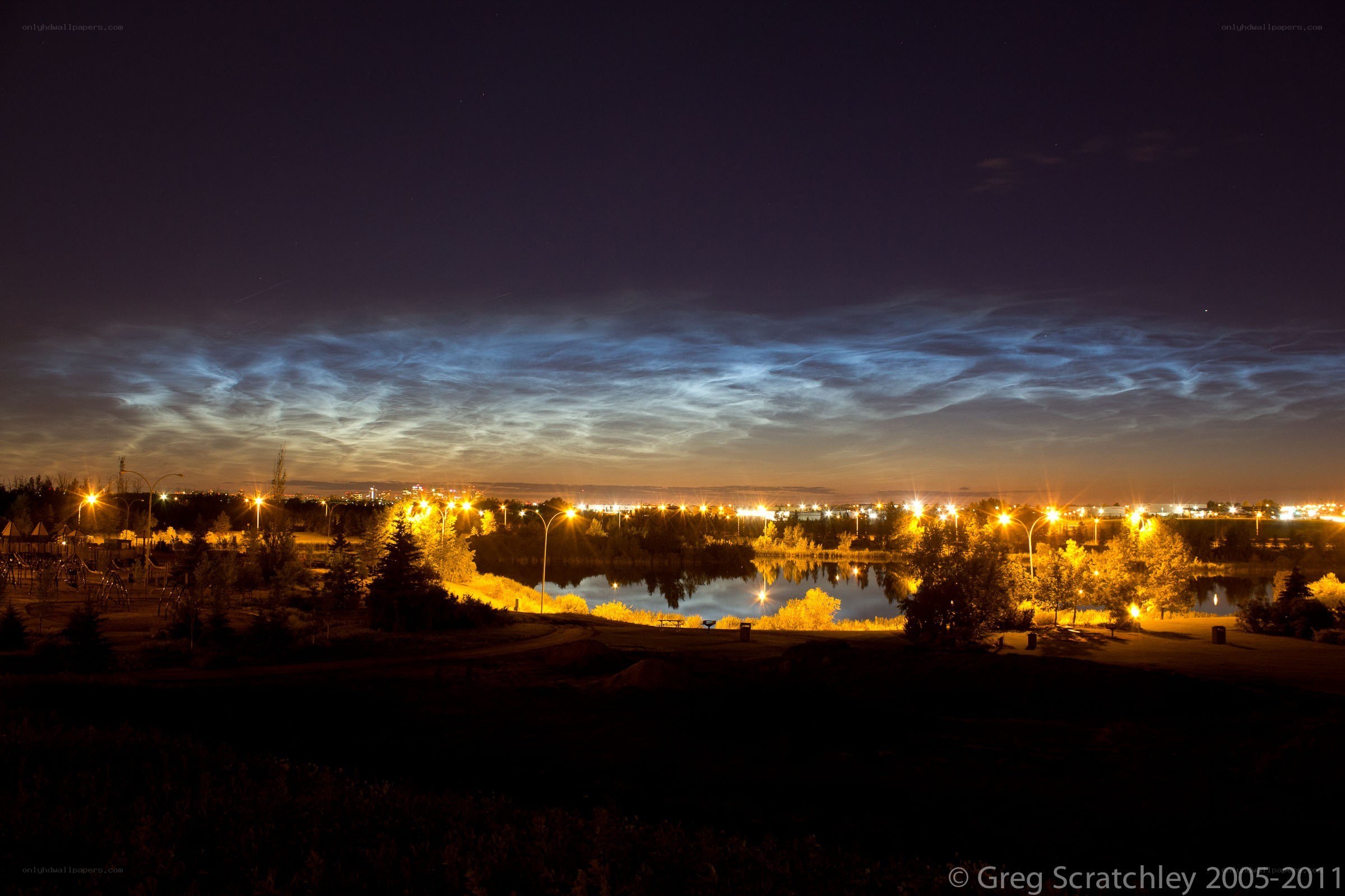 Noctilucent clouds over a park