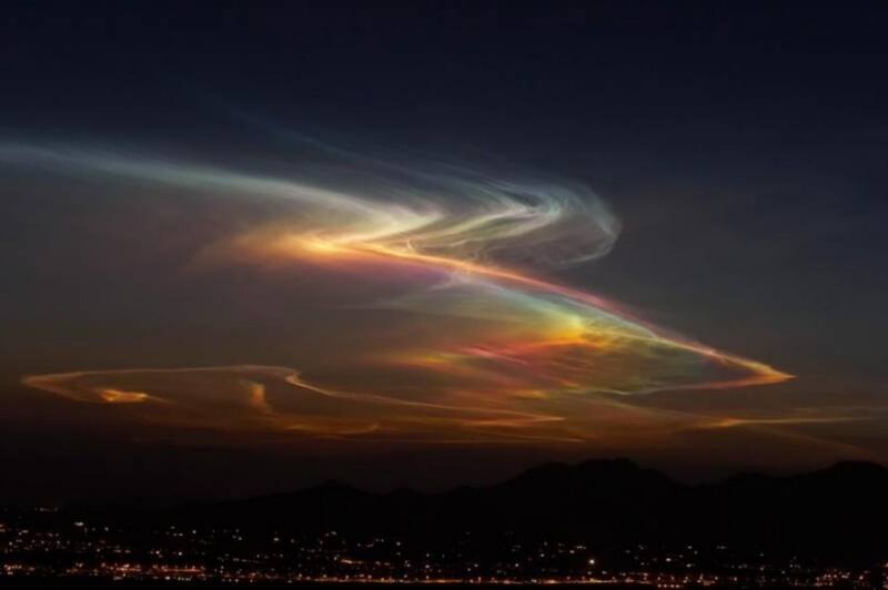 Noctilucent clouds over city