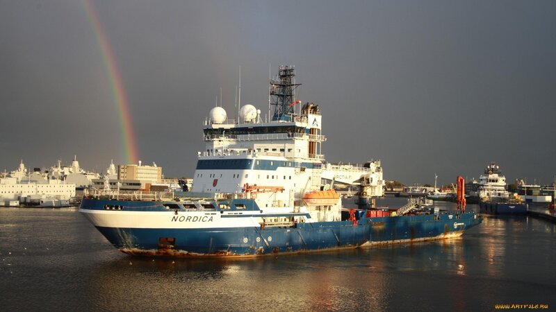 Nordica ship in harbor with rainbow