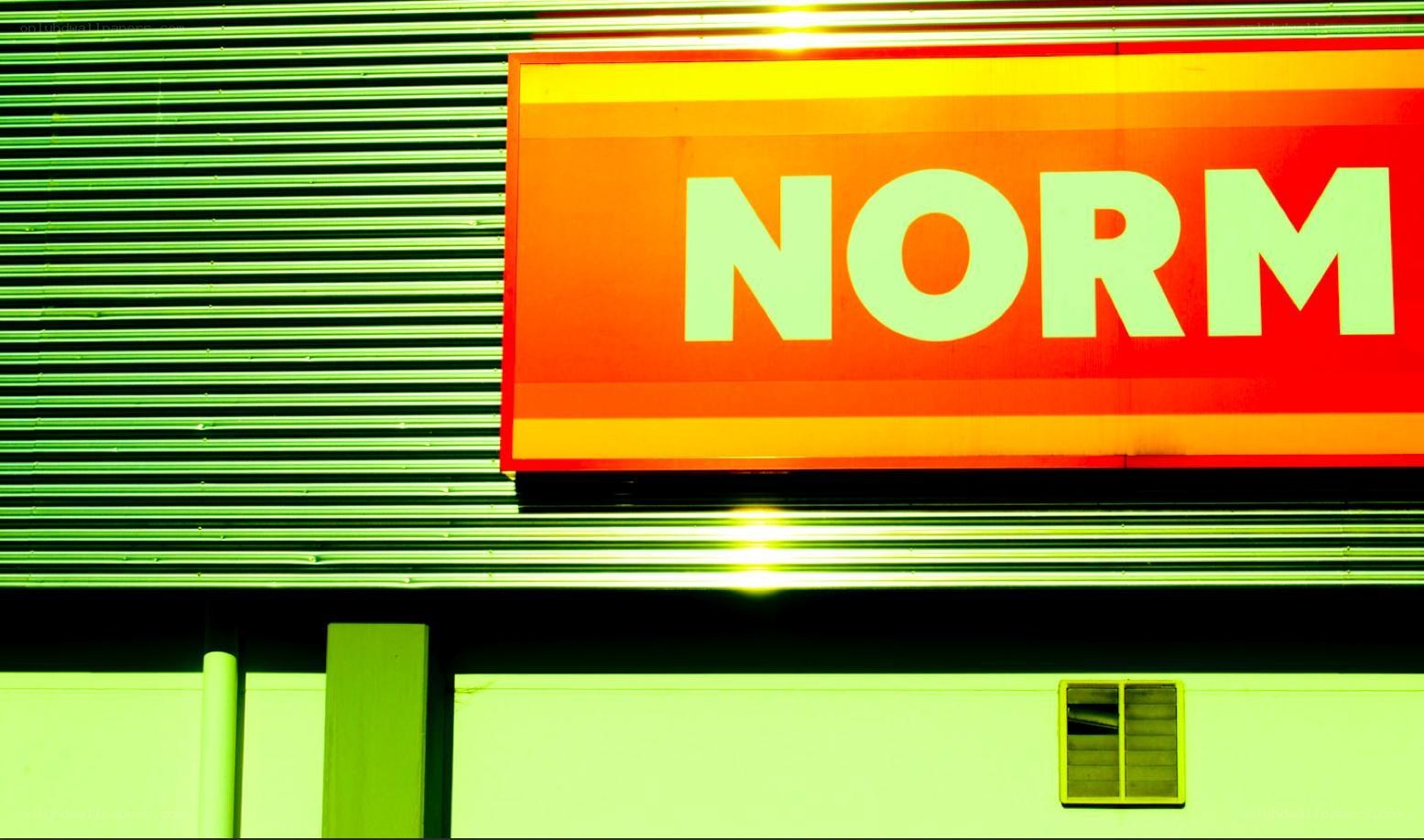 Norm store sign on building