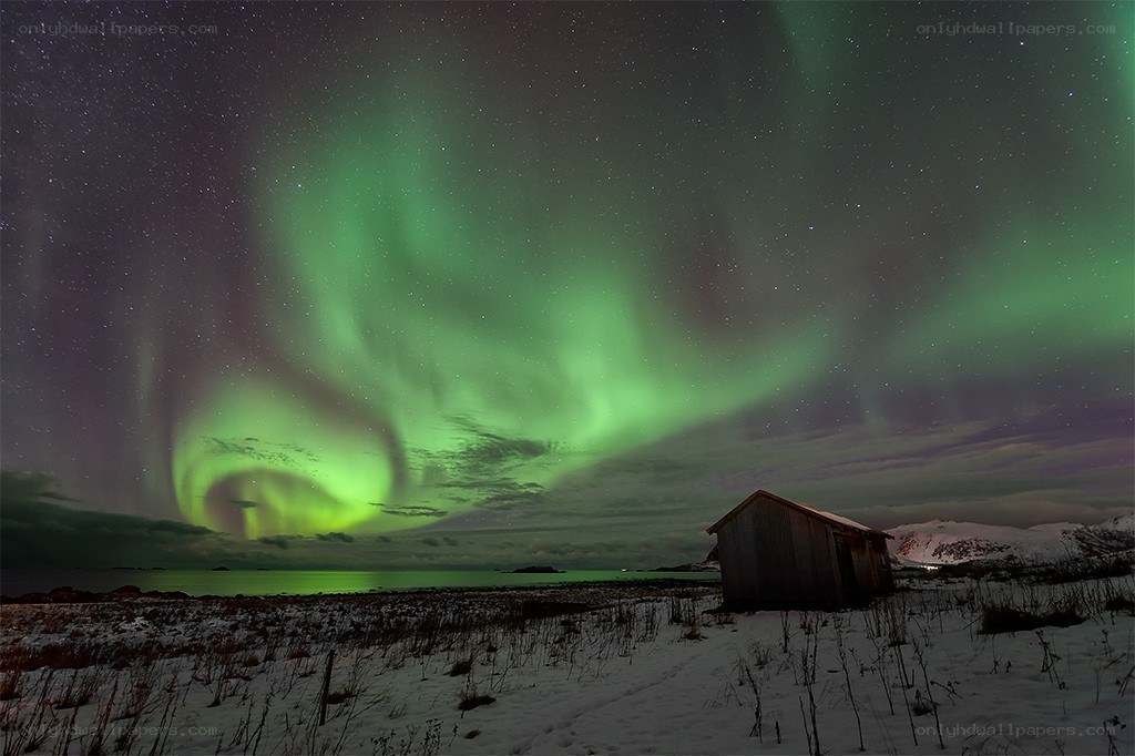 Northern Lights over a cabin