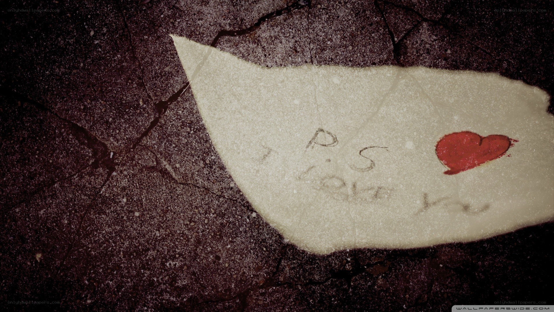 note with heart on ground