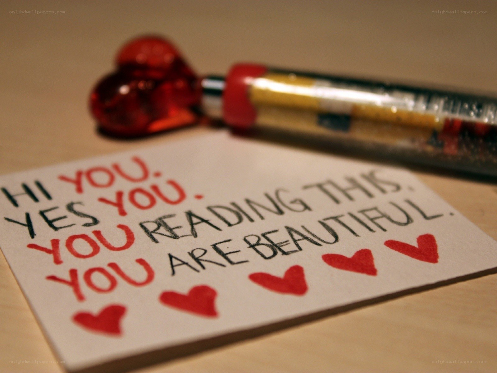 note with heart pen