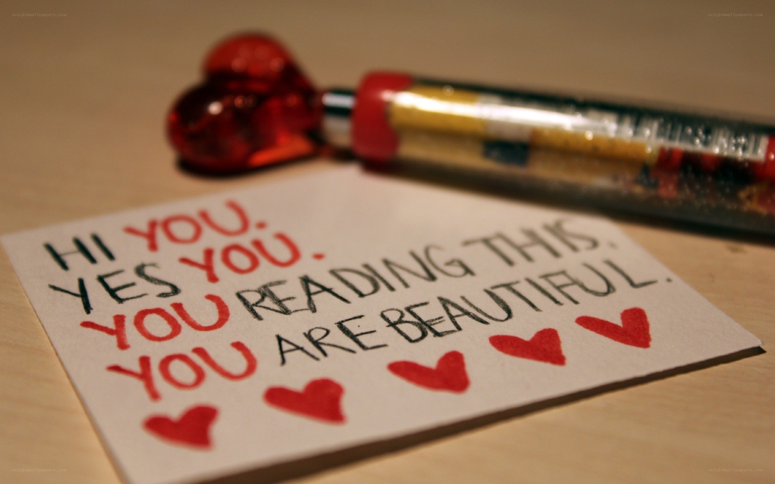 note with heart pen